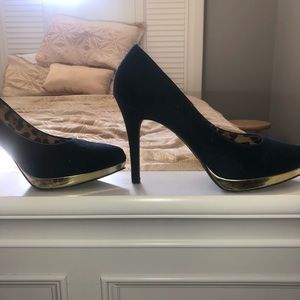 Navy pumps with gold trim